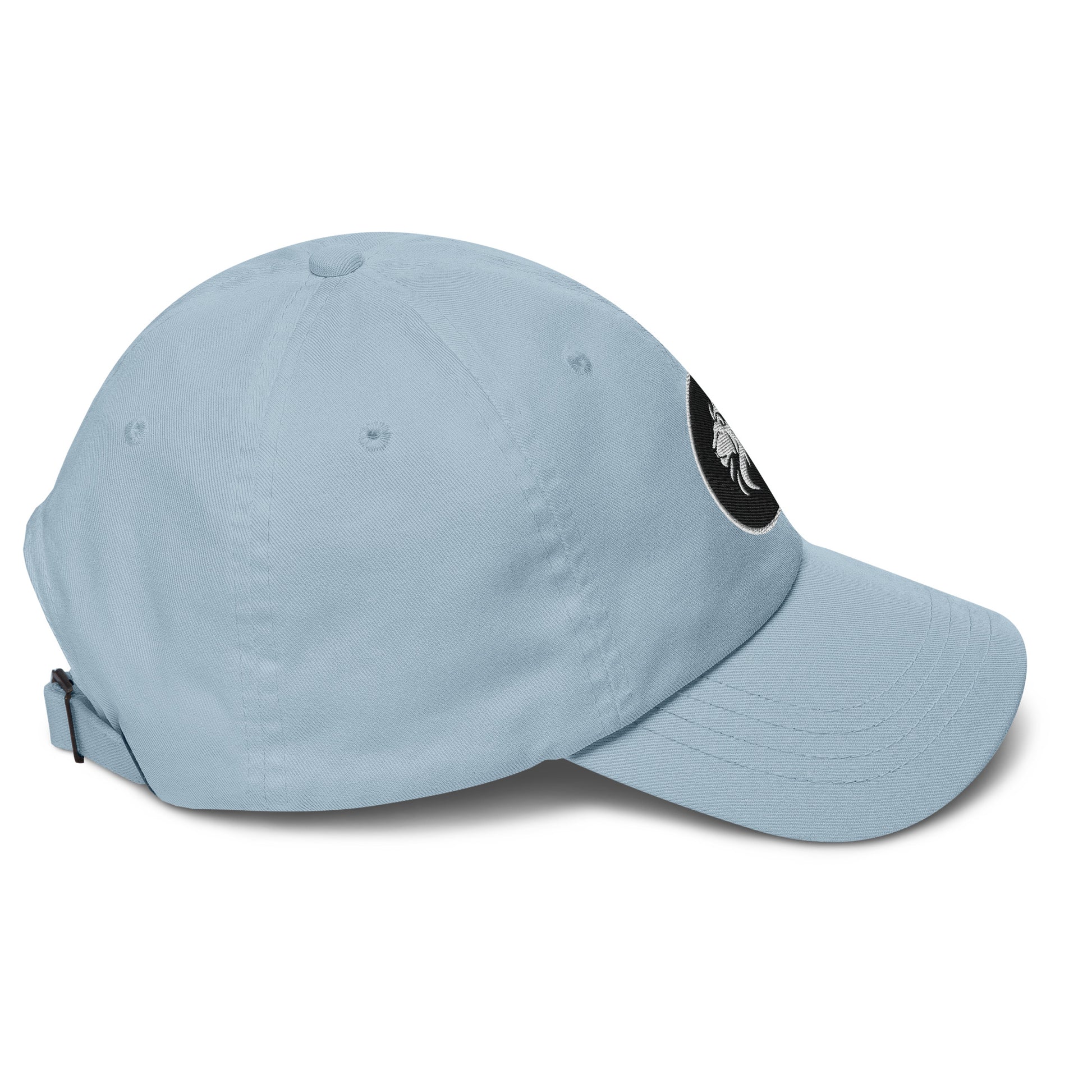 Light blue dad hat with stitched lion design, adjustable strap, and curved visor, perfect for trendy streetwear and eco-friendly fashion.