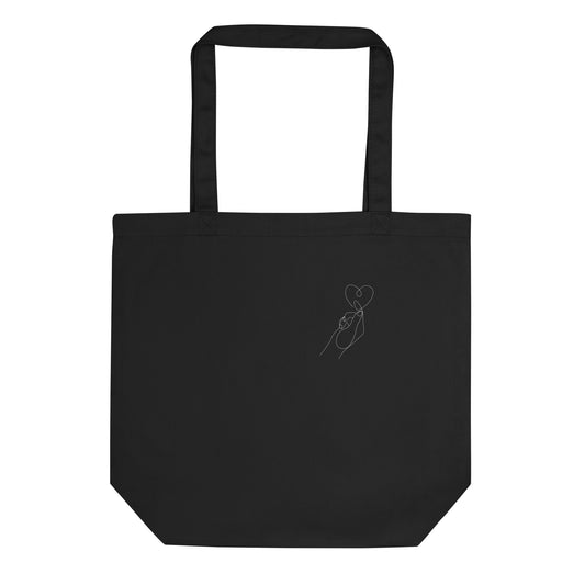 Heart in hand Eco Tote Bag - LUDE fashion, streetwear, unique designs, custom apparel, gift ideas, trendy, eco-friendly, statement pieces, graphic tees, sustainable fashion, minimalist, pop culture, creative prints, bold designs, limited edition, casual wear, artistic, lifestyle