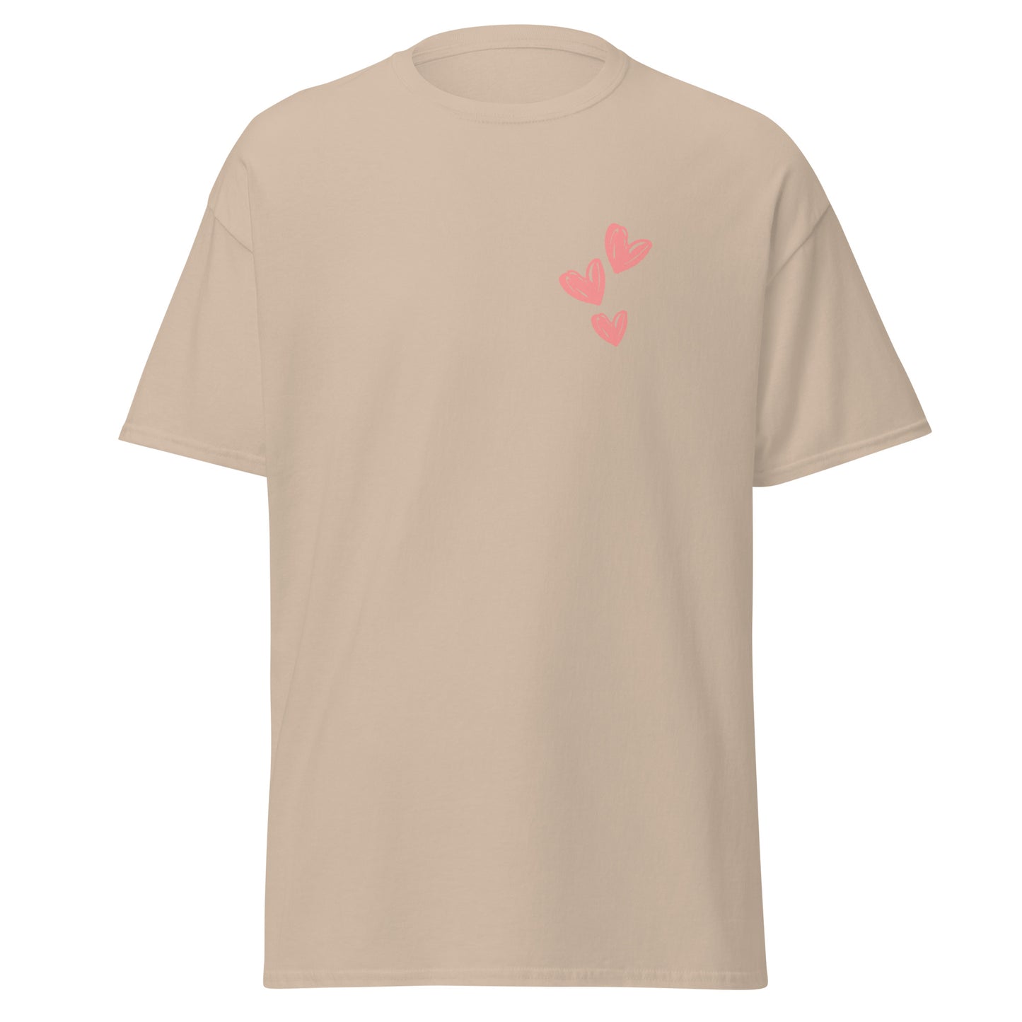 Unisex beige tee with pink heart design, 100% cotton, perfect for streetwear, trendy and sustainable fashion statement piece.